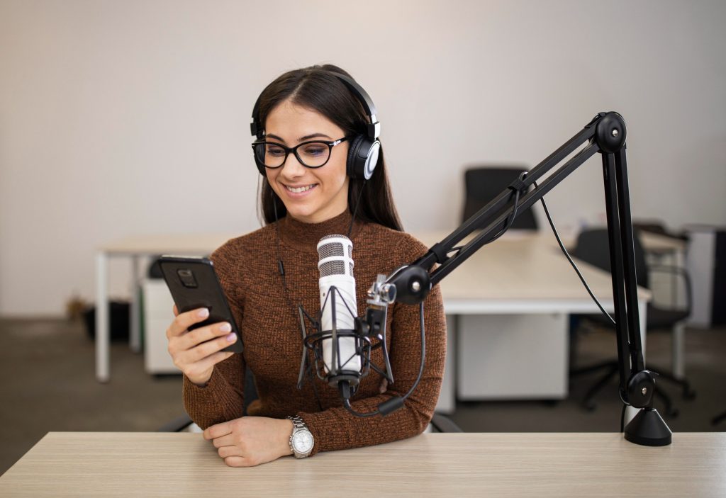 woman using a phone - podcast show notes template