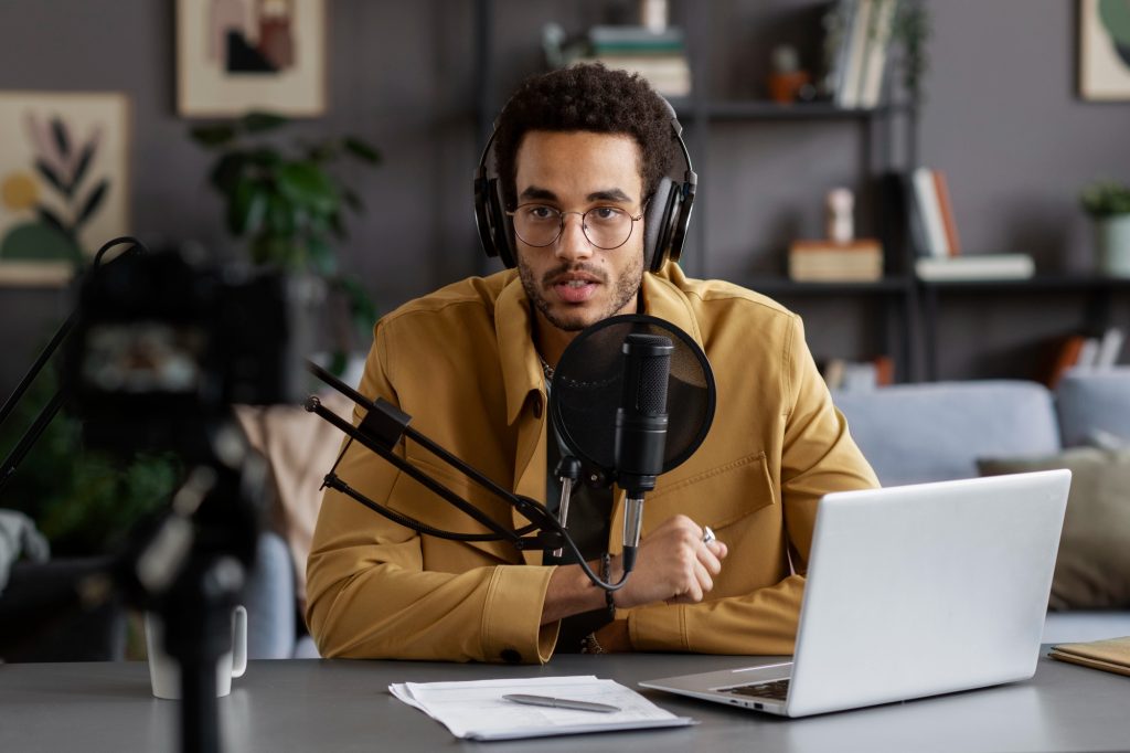 man doing a podcast - upload podcast to YouTube
